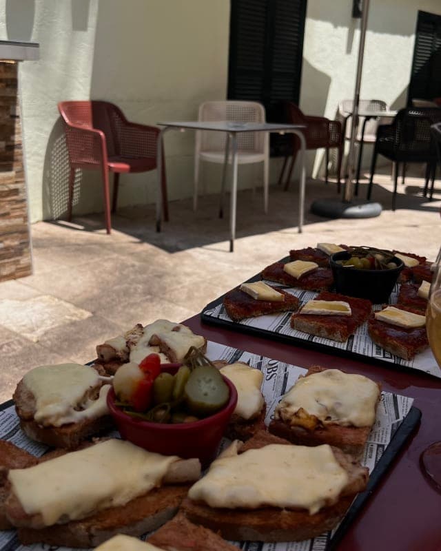 Pan con tomate tapas spread at a Mallorca terrace restaurant